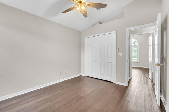 2675 Bond St, Clermont, FL 34711 - unfurnished bedroom featuring lofted ceiling, dark wood-style floors, a closet, and ceiling fan