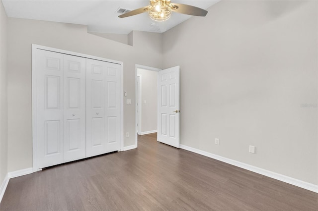 2675 Bond St, Clermont, FL 34711 - unfurnished bedroom with wood finished floors, a closet, ceiling fan, and lofted ceiling