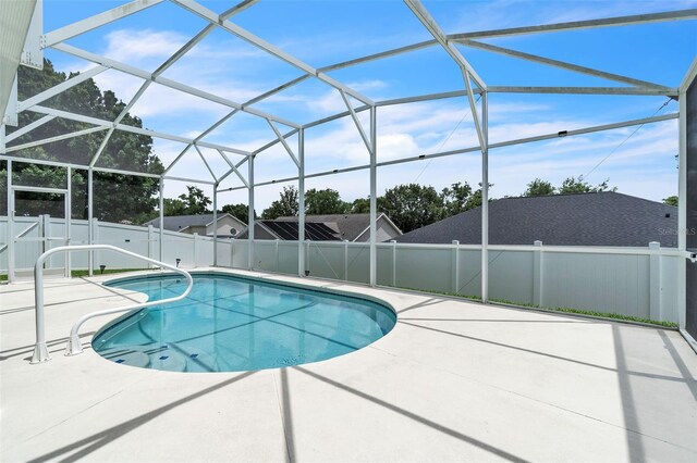 2675 Bond St, Clermont, FL 34711 - view of pool with a patio area, a fenced backyard, and glass enclosure