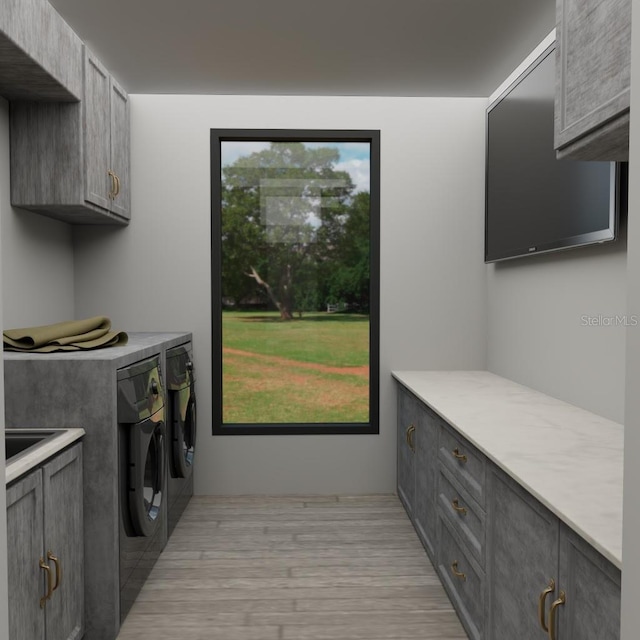TBD SW 177th St, Ocala, FL 34473 - laundry area with washing machine and dryer, cabinet space, and light wood-style flooring
