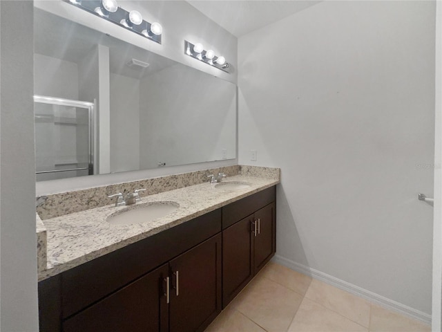 326 Charles Dr, Deland, FL 32724 - full bathroom featuring double vanity, tile patterned flooring, and a stall shower