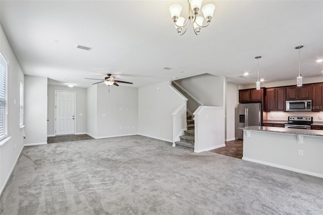 14733 Durbin Island Way, Jacksonville, FL 32259 - unfurnished living room with carpet flooring, stairway, a ceiling fan, a chandelier, and recessed lighting