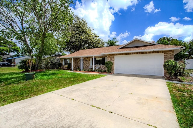 2005 Dalton Ave, Deltona, FL 32725 - ranch-style home with a front yard, driveway, a garage, and brick siding
