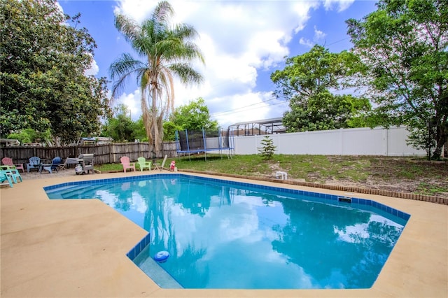 2005 Dalton Ave, Deltona, FL 32725 - view of swimming pool featuring a trampoline, a fenced backyard, and a patio area