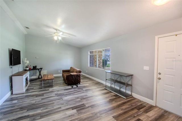 2005 Dalton Ave, Deltona, FL 32725 - living area with wood finished floors, vaulted ceiling, and a ceiling fan