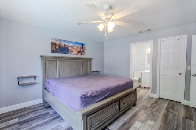 2005 Dalton Ave, Deltona, FL 32725 - bedroom with wood finished floors, ensuite bathroom, and ceiling fan