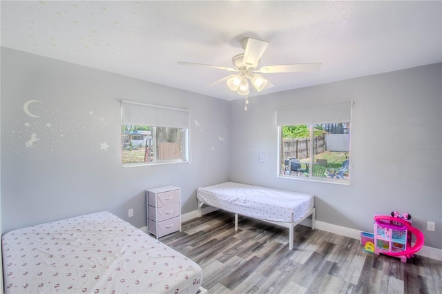 2005 Dalton Ave, Deltona, FL 32725 - bedroom with wood finished floors and ceiling fan