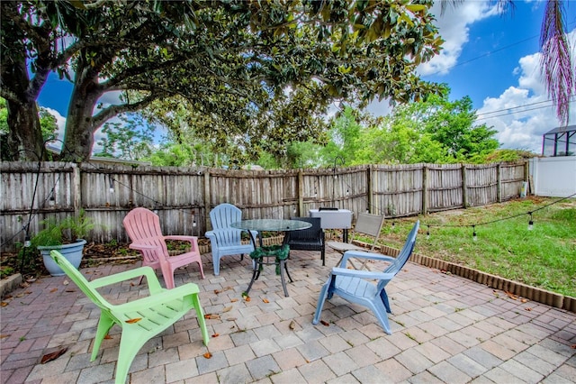 2005 Dalton Ave, Deltona, FL 32725 - fenced backyard featuring a patio area and outdoor dining area