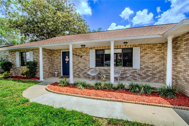 2005 Dalton Ave, Deltona, FL 32725 - view of front of property with covered porch and brick siding