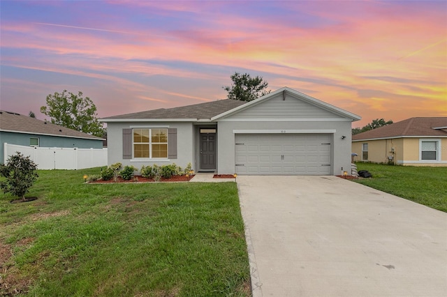 1010 Morvan Ln, Kissimmee, FL 34759 - ranch-style home featuring an attached garage, concrete driveway, and stucco siding