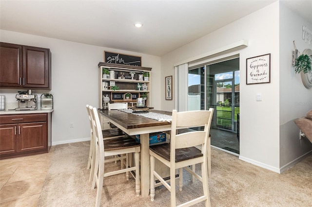 1010 Morvan Ln, Kissimmee, FL 34759 - dining room featuring light carpet and baseboards