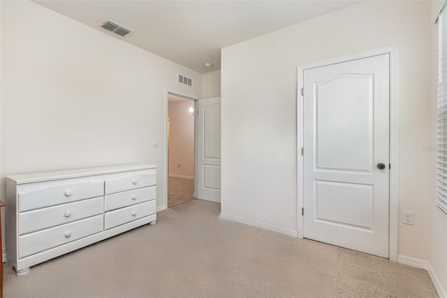 1010 Morvan Ln, Kissimmee, FL 34759 - unfurnished bedroom with light colored carpet and baseboards