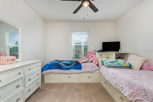 1010 Morvan Ln, Kissimmee, FL 34759 - bedroom featuring multiple windows, light carpet, and a ceiling fan