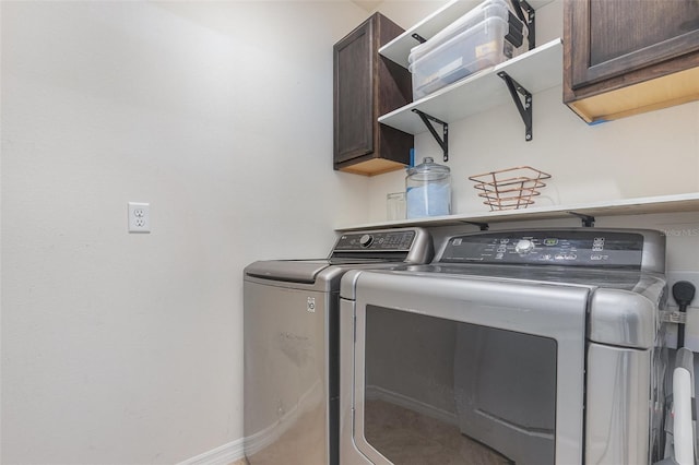 1010 Morvan Ln, Kissimmee, FL 34759 - laundry area with washing machine and dryer and cabinet space