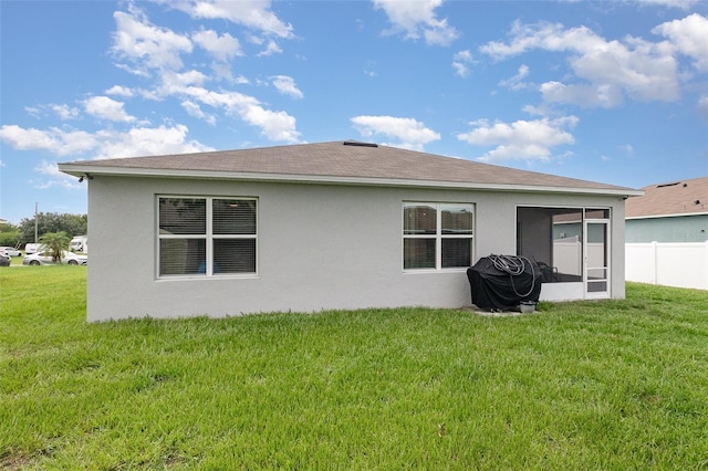 1010 Morvan Ln, Kissimmee, FL 34759 - back of house with a sunroom and stucco siding