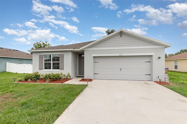 1010 Morvan Ln, Kissimmee, FL 34759 - ranch-style house featuring stucco siding, driveway, and an attached garage