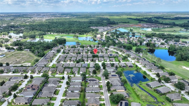 519 Cadiz Dr, Davenport, FL 33837 - aerial view of property's location with nearby suburban area and a large body of water