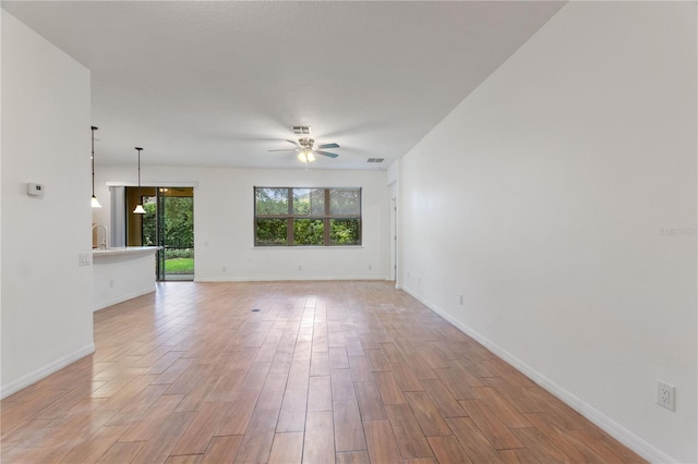 519 Cadiz Dr, Davenport, FL 33837 - unfurnished room featuring a ceiling fan and light wood-type flooring