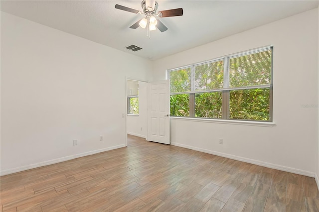 519 Cadiz Dr, Davenport, FL 33837 - empty room featuring a ceiling fan and light wood-style floors