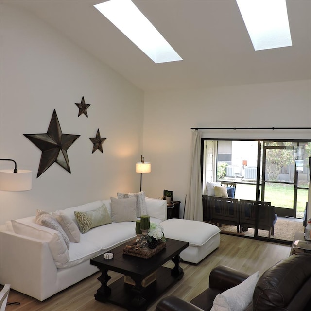 2480 Tahoe Cir Unit 2480, Winter Park, FL 32792 - living area featuring a skylight, wood finished floors, and high vaulted ceiling