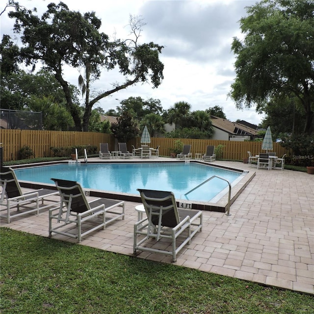2480 Tahoe Cir Unit 2480, Winter Park, FL 32792 - community pool featuring a patio and a fenced backyard