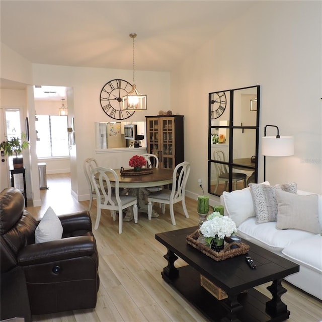 2480 Tahoe Cir Unit 2480, Winter Park, FL 32792 - living area featuring a chandelier and light wood-style floors