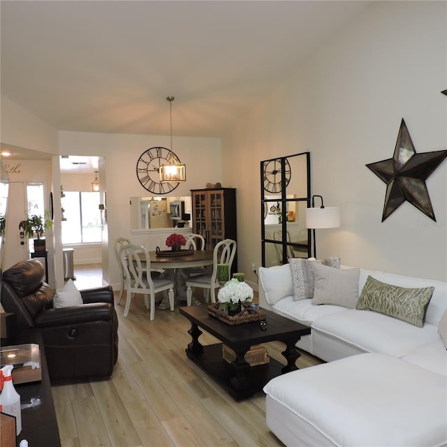 2480 Tahoe Cir Unit 2480, Winter Park, FL 32792 - living room with a chandelier and light wood-style floors
