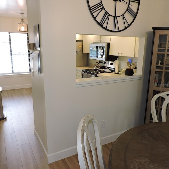 2480 Tahoe Cir Unit 2480, Winter Park, FL 32792 - dining area featuring wood finished floors and baseboards
