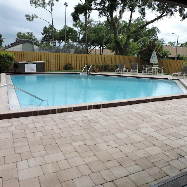 2480 Tahoe Cir Unit 2480, Winter Park, FL 32792 - community pool featuring a fenced backyard and a patio