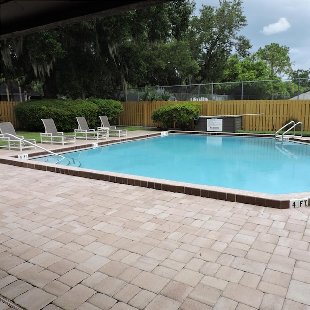 2480 Tahoe Cir Unit 2480, Winter Park, FL 32792 - community pool with a patio and a fenced backyard