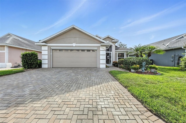 1430 Challenger Ave, Davenport, FL 33897 - single story home with stucco siding, decorative driveway, an attached garage, and a front lawn