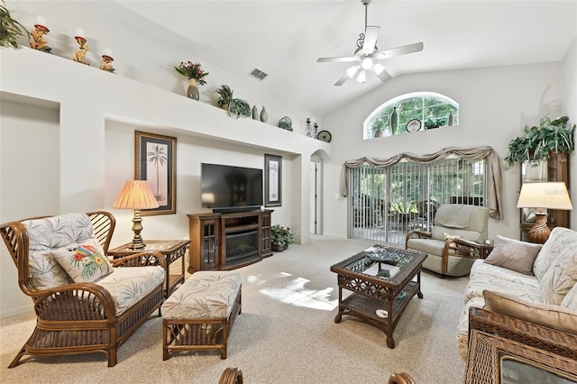 1430 Challenger Ave, Davenport, FL 33897 - living room with carpet, ceiling fan, a fireplace, and high vaulted ceiling