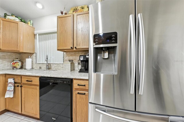 1430 Challenger Ave, Davenport, FL 33897 - kitchen featuring stainless steel refrigerator with ice dispenser, black dishwasher, decorative backsplash, light tile patterned flooring, and light stone countertops