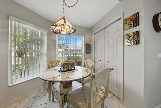 1430 Challenger Ave, Davenport, FL 33897 - dining space featuring a chandelier and light tile patterned flooring