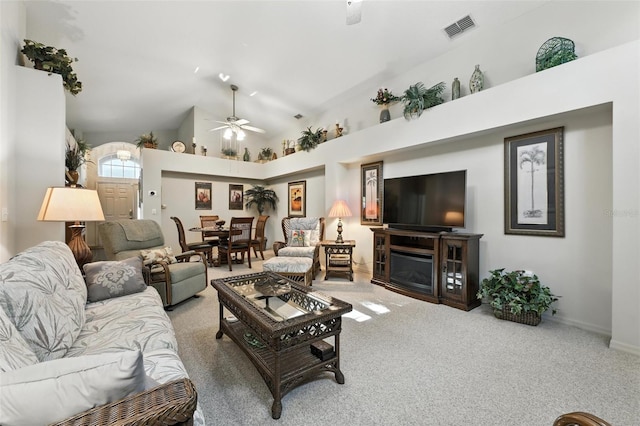1430 Challenger Ave, Davenport, FL 33897 - carpeted living room with a ceiling fan, lofted ceiling, and a fireplace