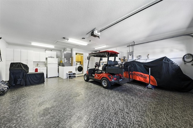 1430 Challenger Ave, Davenport, FL 33897 - garage with washer / clothes dryer, freestanding refrigerator, electric panel, a garage door opener, and heating unit