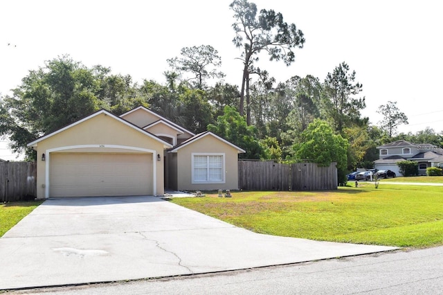1436 Swan Ct, Kissimmee, FL 34759 - view of front facade featuring concrete driveway, a garage, stucco siding, and view of wooded area