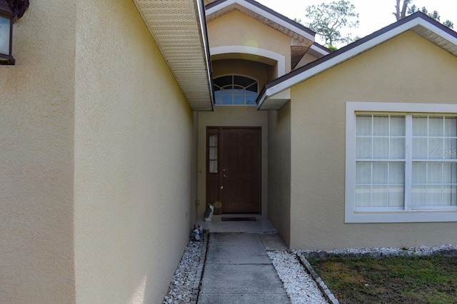1436 Swan Ct, Kissimmee, FL 34759 - property entrance with stucco siding
