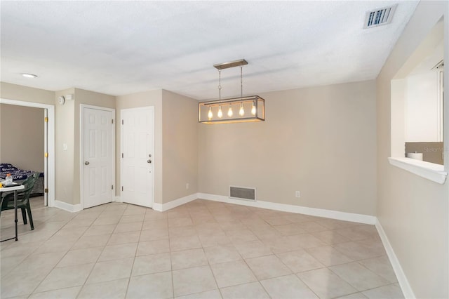 5057 Maui Cir Unit 15, Orlando, FL 32808 - unfurnished dining area featuring light tile patterned floors