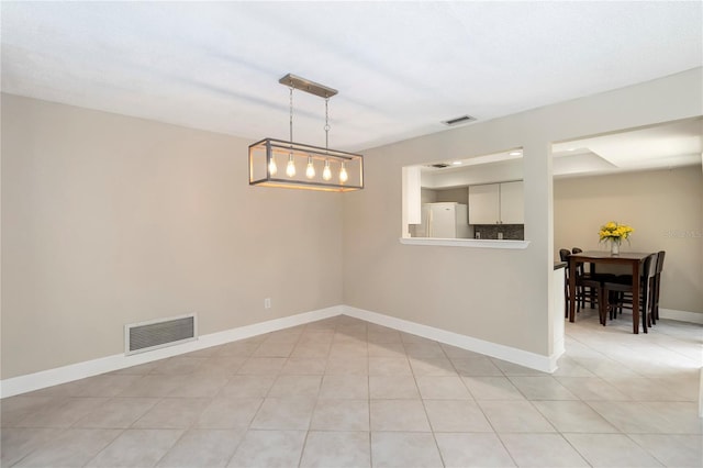 5057 Maui Cir Unit 15, Orlando, FL 32808 - spare room featuring baseboards and light tile patterned floors
