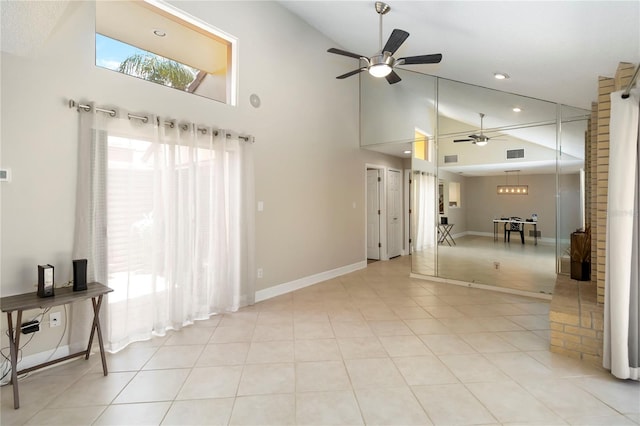 5057 Maui Cir Unit 15, Orlando, FL 32808 - unfurnished living room with a ceiling fan, high vaulted ceiling, recessed lighting, and light tile patterned floors