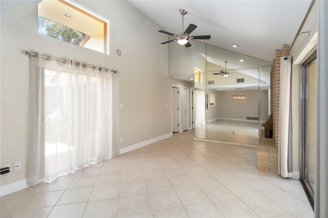 5057 Maui Cir Unit 15, Orlando, FL 32808 - unfurnished living room with ceiling fan, high vaulted ceiling, light tile patterned floors, and recessed lighting