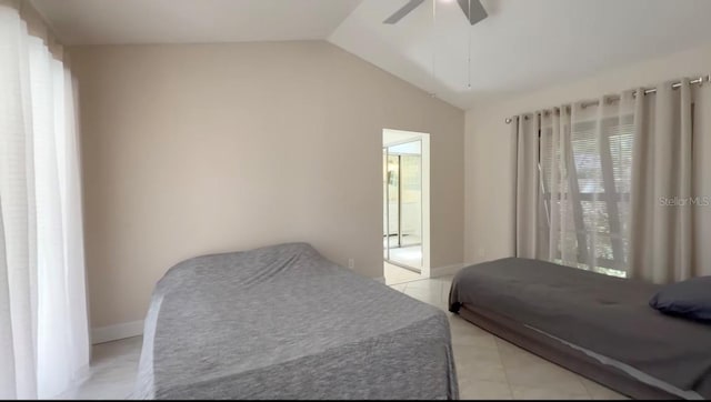 5057 Maui Cir Unit 15, Orlando, FL 32808 - bedroom with lofted ceiling, a ceiling fan, and light tile patterned floors