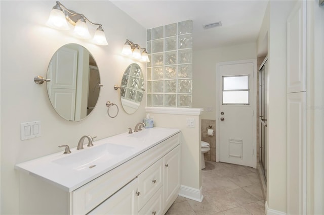 5057 Maui Cir Unit 15, Orlando, FL 32808 - full bathroom with double vanity, tile patterned flooring, and an enclosed shower