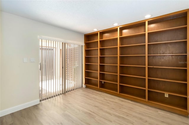 5057 Maui Cir Unit 15, Orlando, FL 32808 - spare room featuring wood finished floors, recessed lighting, and a textured ceiling