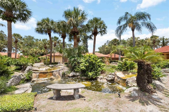 5057 Maui Cir Unit 15, Orlando, FL 32808 - view of yard featuring a small pond