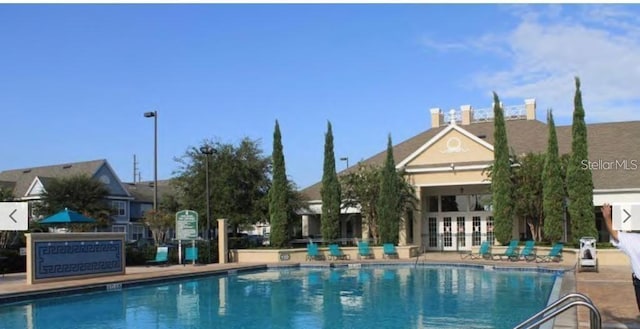 4019 Venetian Bay Dr Unit 107, Kissimmee, FL 34741 - community pool featuring french doors