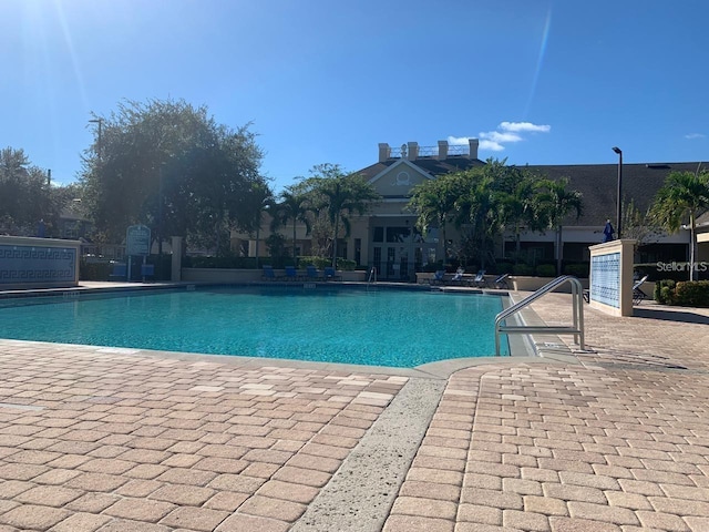 4019 Venetian Bay Dr Unit 107, Kissimmee, FL 34741 - community pool featuring a patio