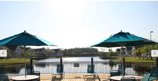 4019 Venetian Bay Dr Unit 107, Kissimmee, FL 34741 - view of patio / terrace featuring a water view