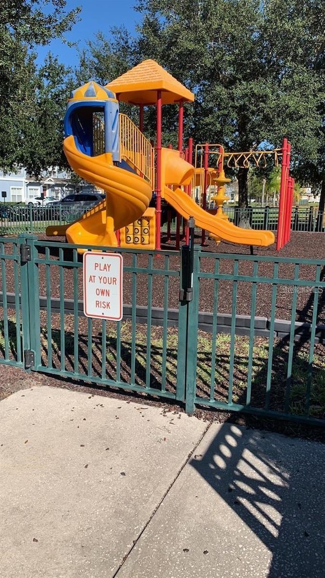 4019 Venetian Bay Dr Unit 107, Kissimmee, FL 34741 - communal playground featuring a gate
